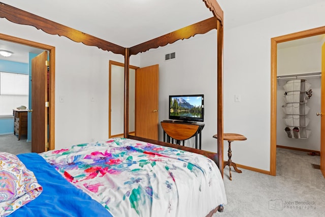 carpeted bedroom featuring a closet