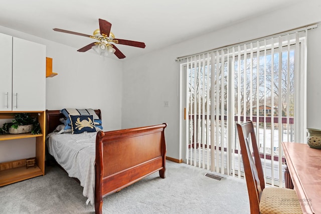 bedroom with ceiling fan, light colored carpet, and access to exterior