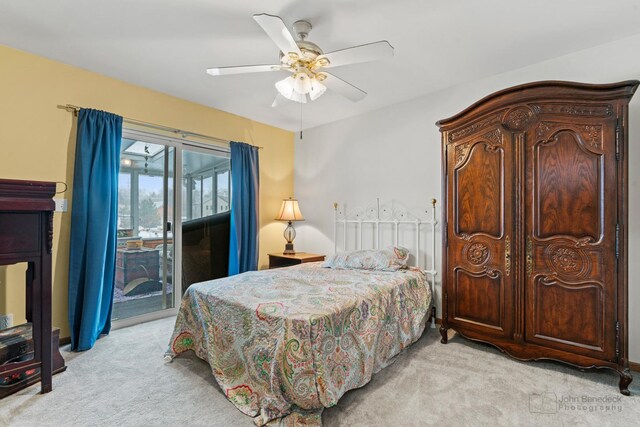 carpeted bedroom with access to exterior and ceiling fan