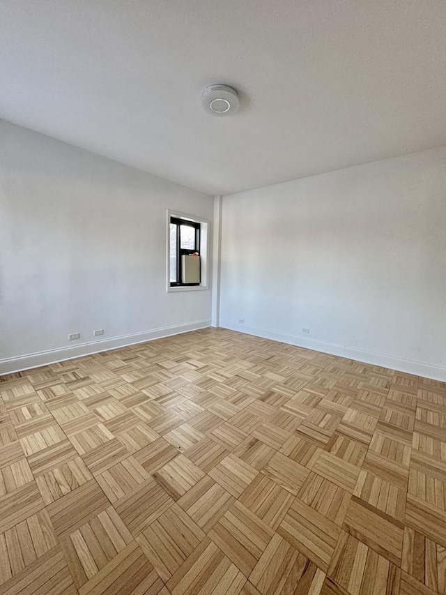 spare room with light parquet flooring