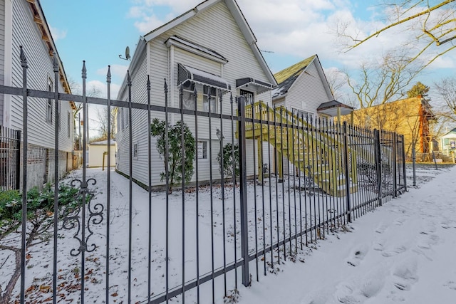 view of snow covered gate