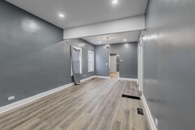 unfurnished living room with light wood-type flooring