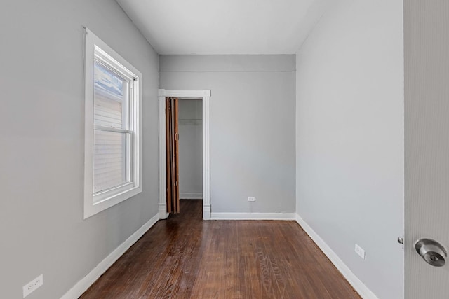 unfurnished room featuring dark hardwood / wood-style floors