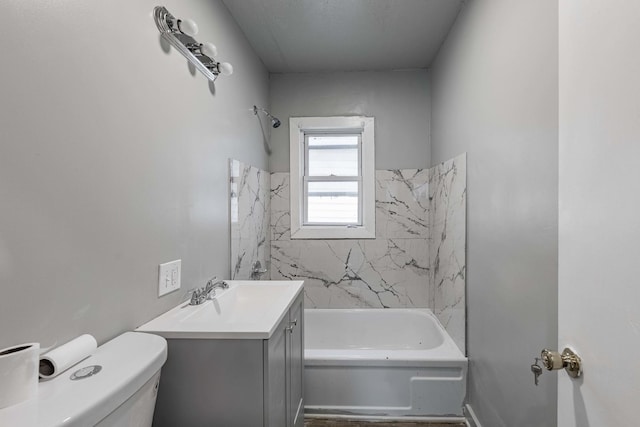 full bathroom featuring vanity, toilet, and tiled shower / bath