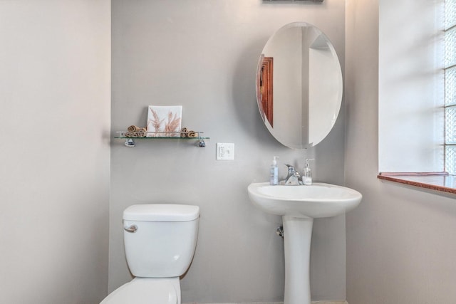 bathroom with sink and toilet