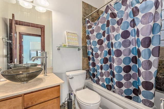 full bathroom featuring vanity, toilet, and shower / tub combo with curtain