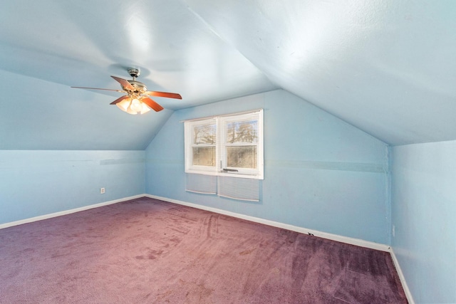 additional living space with ceiling fan, lofted ceiling, and carpet