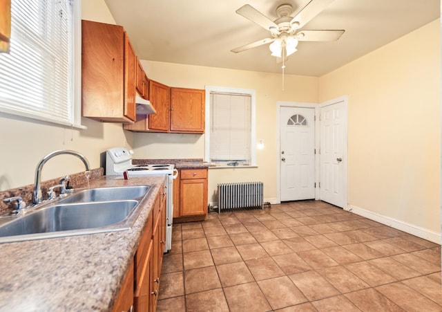 kitchen with sink, ceiling fan, radiator heating unit, white electric range oven, and light tile patterned flooring