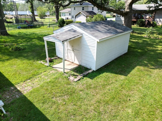 view of outbuilding with a lawn