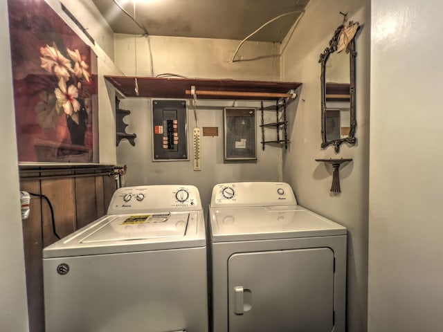 washroom featuring washing machine and dryer and electric panel