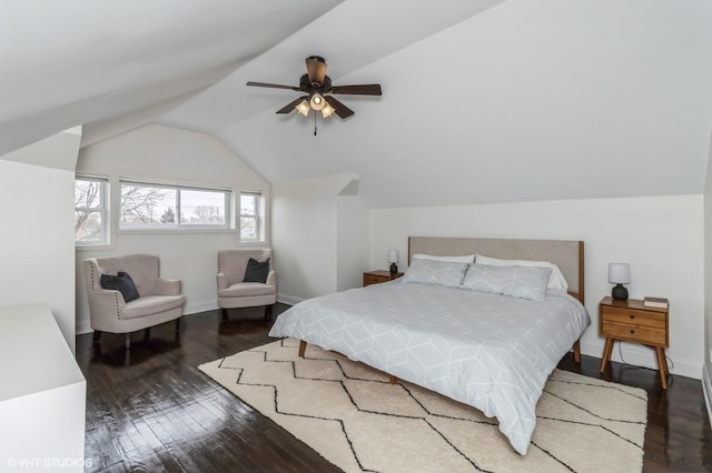 bedroom featuring vaulted ceiling, ceiling fan, and dark hardwood / wood-style flooring