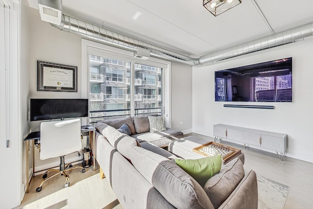 living room with light hardwood / wood-style floors