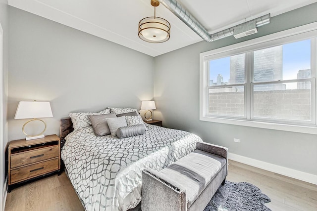 bedroom featuring light hardwood / wood-style floors