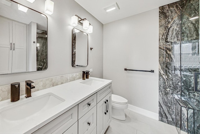 bathroom featuring vanity, tile patterned floors, and toilet