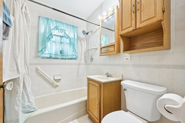 full bathroom with toilet, tile walls, vanity, shower / bath combo with shower curtain, and tile patterned flooring