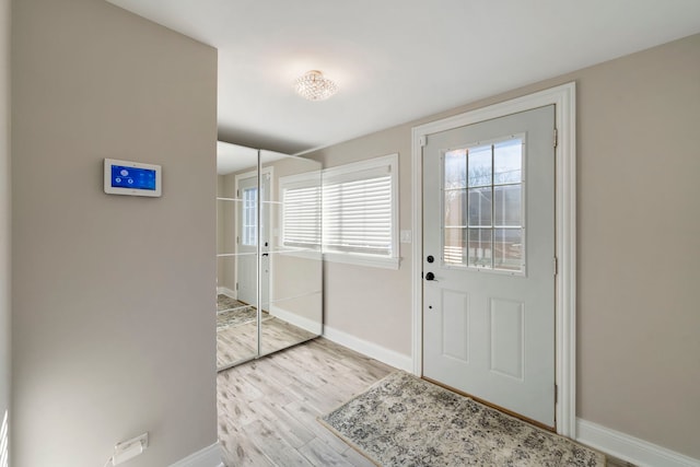 doorway to outside featuring light wood-type flooring