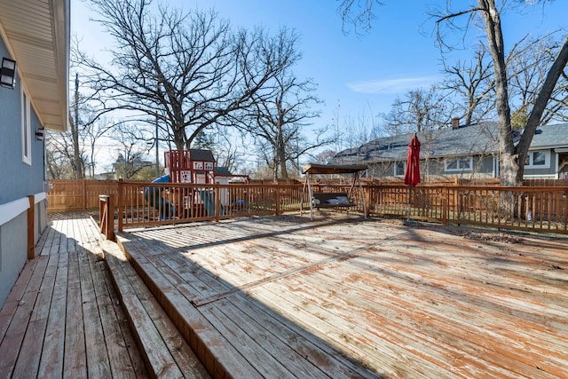 wooden deck with a playground