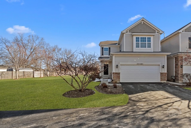 view of front facade featuring a garage and a front lawn