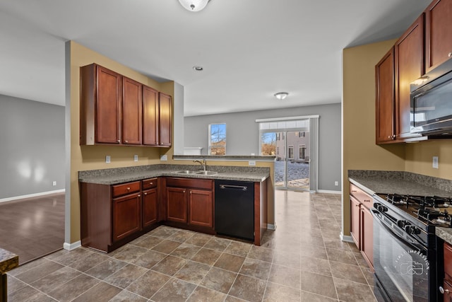 kitchen featuring sink, black appliances, and kitchen peninsula