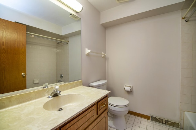 bathroom with toilet, tile patterned floors, and vanity