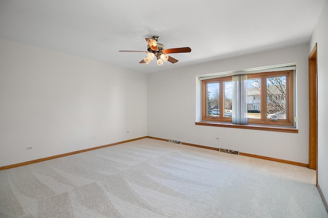 empty room with light carpet and ceiling fan