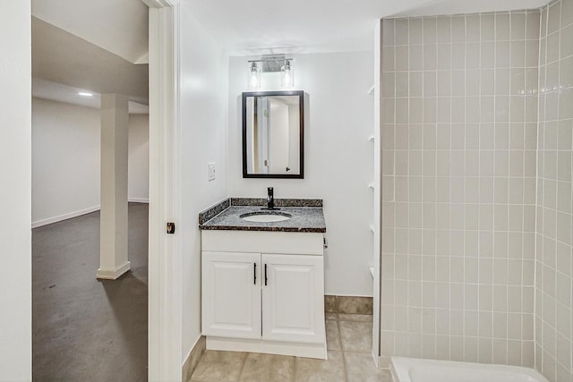 bathroom featuring a shower and vanity