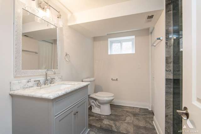 bathroom with toilet and vanity