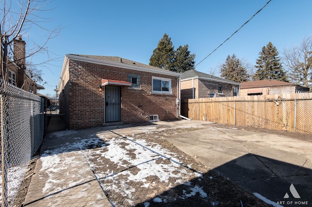 back of property with a patio