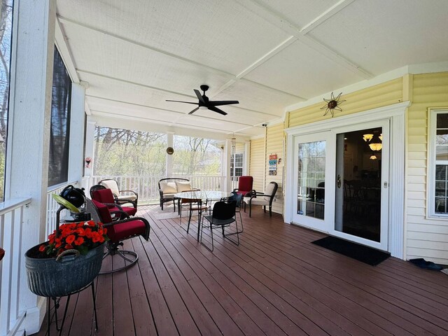 sunroom / solarium featuring ceiling fan