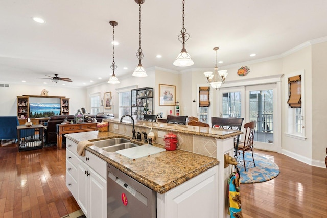 kitchen with dark wood-style floors, a kitchen island with sink, dishwasher, and a sink