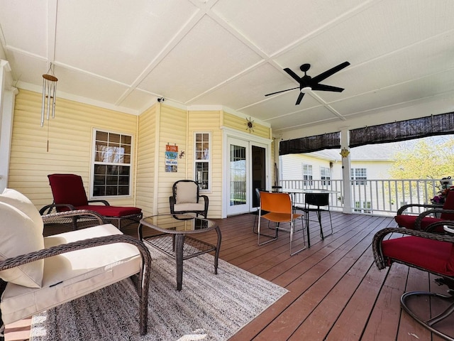 wooden deck featuring ceiling fan