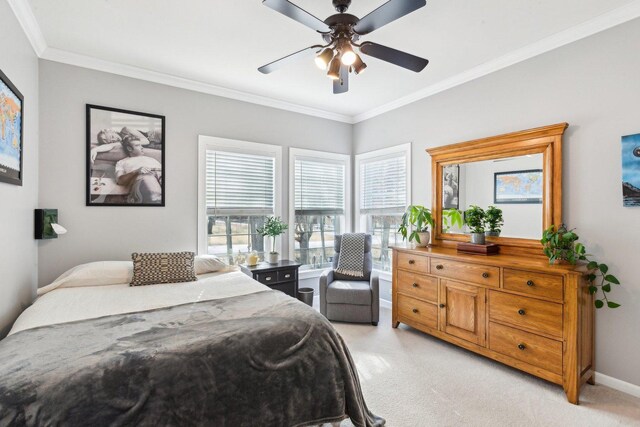 bedroom with visible vents, crown molding, baseboards, and wood finished floors