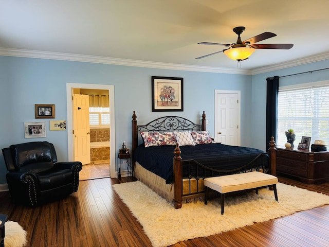 bedroom with crown molding, multiple windows, and hardwood / wood-style floors