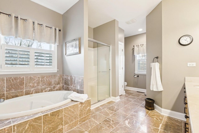 full bathroom with marble finish floor, toilet, a garden tub, and a stall shower
