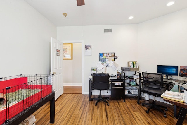 office featuring baseboards, visible vents, wood finished floors, and recessed lighting