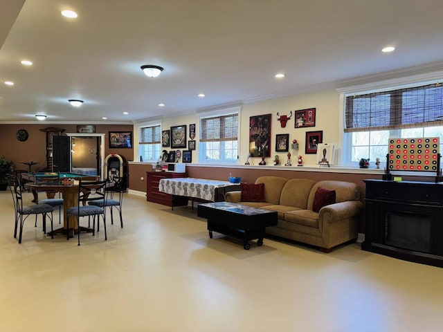 living room featuring ornamental molding and recessed lighting