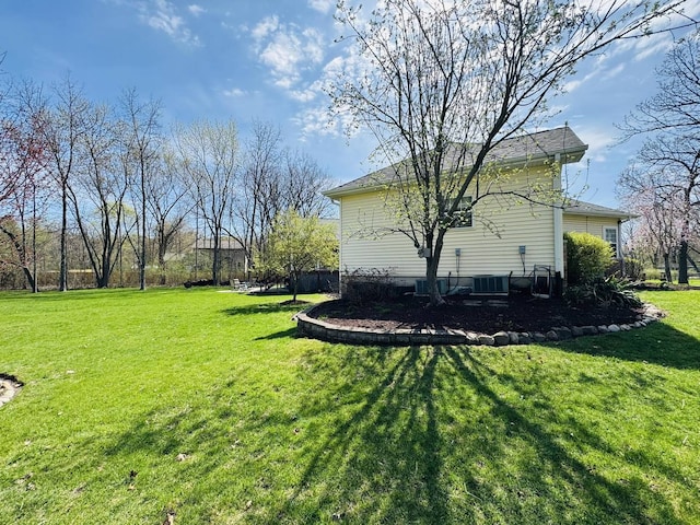 view of yard with central AC unit