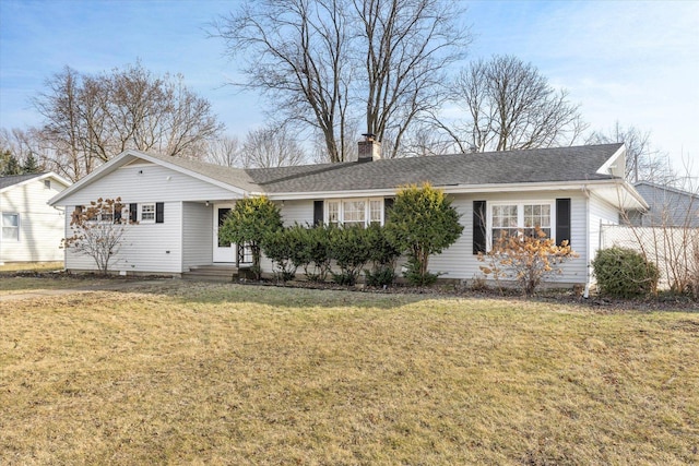 single story home featuring a front lawn