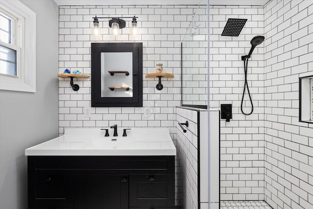 bathroom featuring tasteful backsplash, vanity, and an enclosed shower