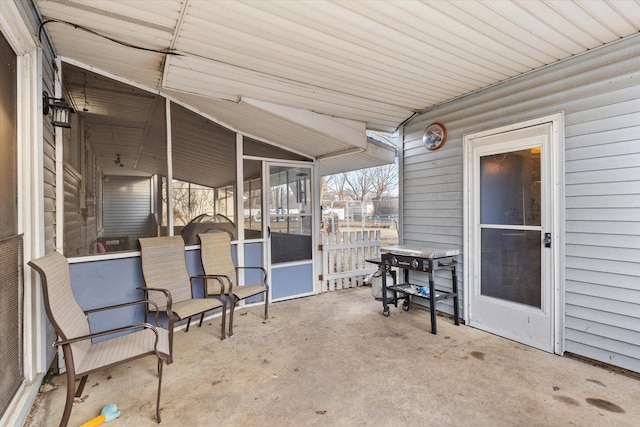 view of patio / terrace featuring a sunroom