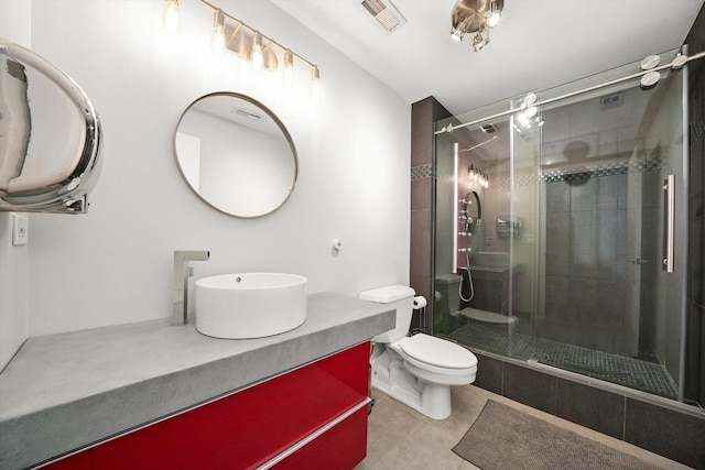 bathroom featuring toilet, walk in shower, and vanity