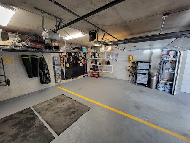 garage featuring a workshop area and a garage door opener