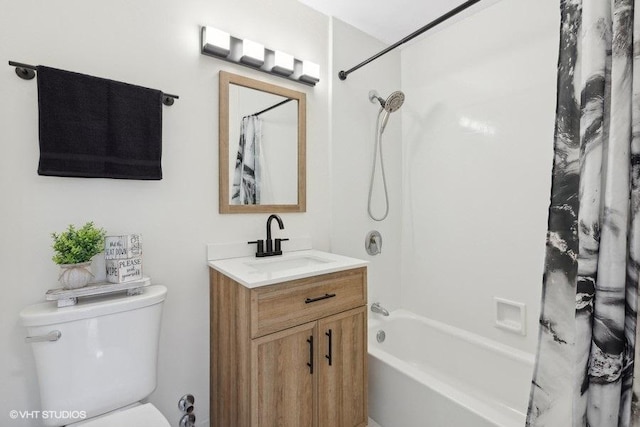 full bathroom featuring shower / tub combo with curtain, vanity, and toilet