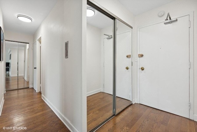 corridor featuring hardwood / wood-style flooring