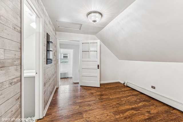 bonus room featuring a baseboard heating unit, vaulted ceiling, dark hardwood / wood-style floors, wooden walls, and radiator heating unit