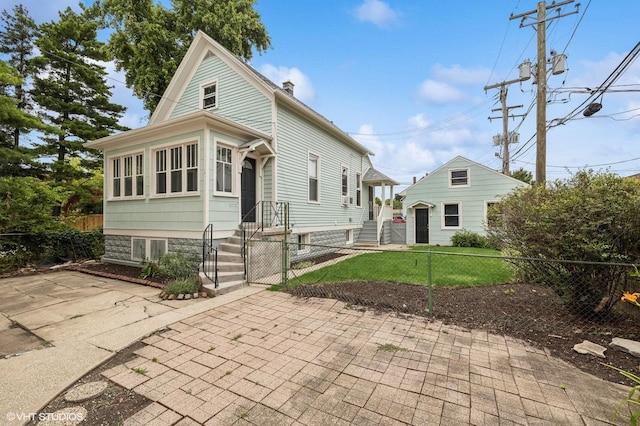 view of front of home with a front yard