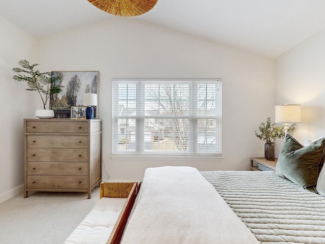 carpeted bedroom featuring vaulted ceiling