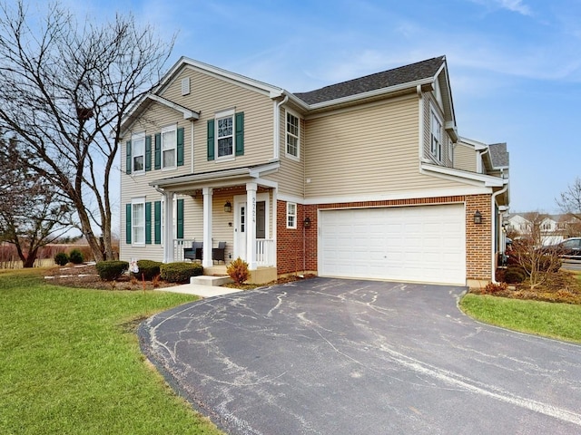 view of front facade featuring a garage and a front lawn