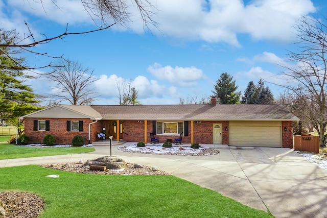 ranch-style house featuring a garage and a front lawn