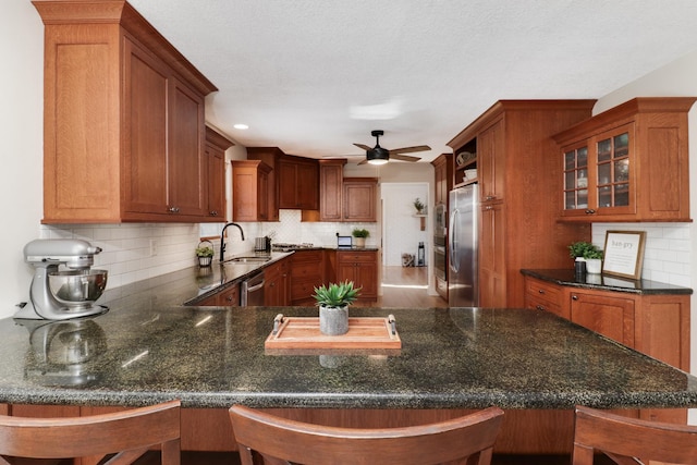 kitchen featuring kitchen peninsula and a breakfast bar area